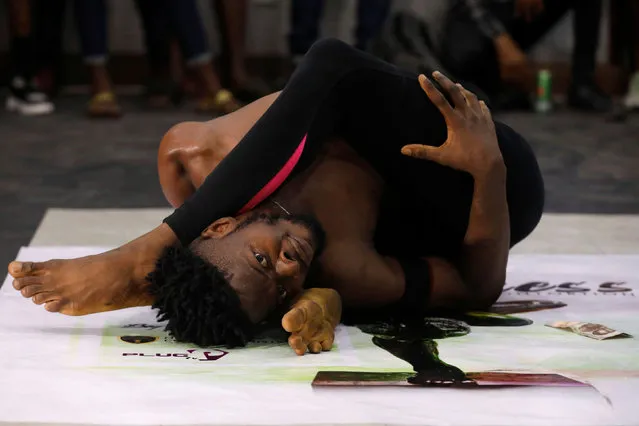 Oyindamola Kolawole, 26, performs contortion at a show called Limberness in Lagos, Nigeria on February 1, 2020. (Photo by Temilade Adelaja/Reuters)