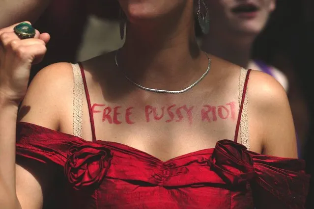 A woman wears on her chest the text 'free p*ssy riot' as a demonstration by supporters of the jailed feminist punk band 'p*ssy Riot' takes place outside the Russian Embassy on August 17, 2012 in London, England. The three women who staged an anti-Kremlin protest in a church in February, were found guilty today of hooliganism motivated by religious hatred, and could face a three-year jail sentence. Supporters are gathering in several cities around the world today as a mark of solidarity. (Photo by Dan Kitwood)