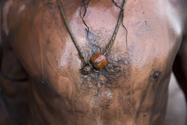 An Indian Sadhu, or Hindu holy man, wears a wooden bead in Nasik, India, Saturday,  August 29, 2015. (Photo by Tsering Topgyal/AP Photo)