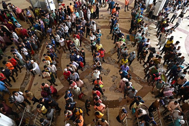 People crowd to buy advance train tickets at a railway station ahead of the Muslim festival of Eid al-Adha, in Dhaka on July 5, 2022. (Photo by Munir Uz Zaman/AFP Photo)