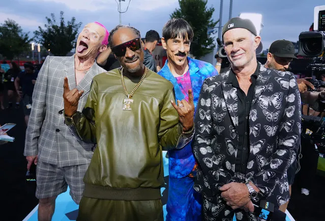 Snoop Dogg (2nd L) poses with (from L) Flea, Anthony Kiedis, and Chad Smith of Red Hot Chili Peppers attend the 2022 MTV VMAs at Prudential Center on August 28, 2022 in Newark, New Jersey. (Photo by Jeff Kravitz/Getty Images for MTV/Paramount Global)