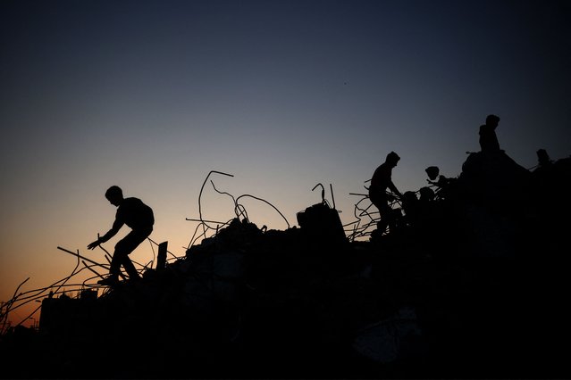 Children play on the rubble of destroyed buildings at the Bureij camp for displaced Palestinians on January 2, 2025, amid the continuing war between Israel and the militant Hamas group. (Photo by Eyad Baba/AFP Photo)
