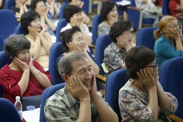 Grandparents take part in a child care class for them in Seoul, South Korea, September 1, 2015. It is not unusual for South Koreans to pay their parents to take care of their children. But the number doing so is on the rise and the arrangement has become more professional-like as parents increasingly pay the equivalent of full babysitting rates. (Photo by Kim Hong-Ji/Reuters)