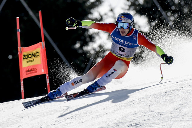 Switzerland's Marco Odermatt speeds down the course during a men's Super-G, at the Alpine Ski World Championships, in Saalbach-Hinterglemm, Austria, Friday, February 7, 2025. (Photo by Gabriele Facciotti/AP Photo)
