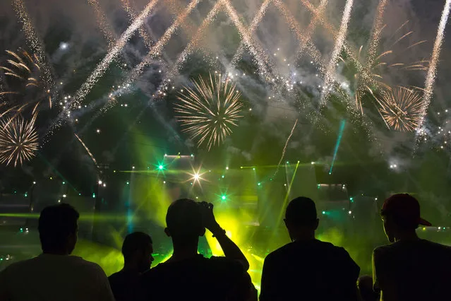 Fireworks light up the sky before the opening show of the Rock in Rio music festival in Rio de Janeiro, Brazil, Friday, September 18, 2015. Some of the performers invited to perform in this year's festival are the reunited Faith No More, System of a Down, Queens of the Stone Age, Slipknot, Metallica, Elton John, Motley Crue, Rod Stewart, Elton John, and Seal. (Photo by Felipe Dana/AP Photo)