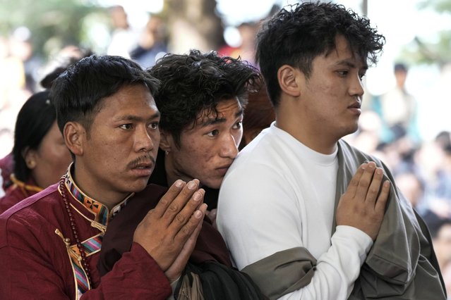 Exiled Tibetans listen to Tibetan spiritual leader the Dalai Lama, unseen, on the 15th day of the Tibetan New Year at the Tsuglakhang temple in Dharamshala, India, Friday, March 14, 2025. (Photo by Ashwini Bhatia/AP Photo)