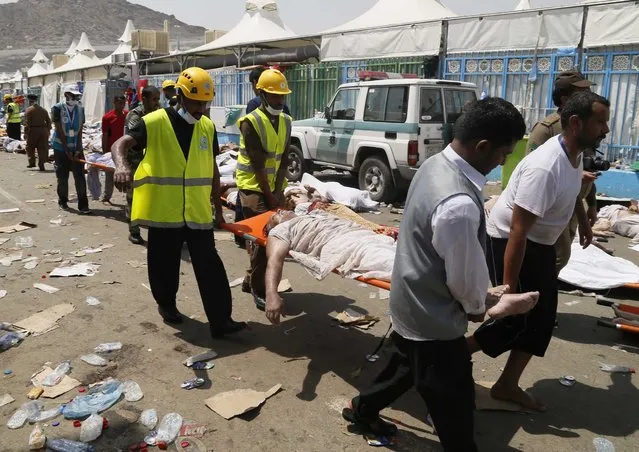 Emergency services attend to victims of a crush in Mina, Saudi Arabia during the annual hajj pilgrimage on Thursday, September 24, 2015. (Photo by AP Photo)