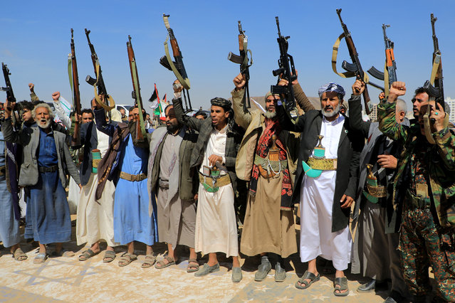 Armed supporters of Yemen's Huthi rebels attend a rally in solidarity with the the Palestinian Hamas movement's armed resistance against Israel in the capital Sanaa on January 29, 2024, amid the continuing battles between Israeli forces and Hamas in Gaza. Since shortly after the Israel-Hamas war in Gaza broke out on October 7, the Huthis have launched a spate of missile and drone attacks on passing commercial ships in the Red Sea which they say are linked to Israel. (Photo by Mohammed Huwais/AFP Photo)