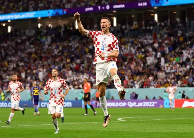 Ivan Perisic of Croatia celebrates with team mates after scoring his goal ,during the FIFA World Cup Qatar 2022 Round of 16 match between Japan and Croatia at Al Janoub Stadium on December 5, 2022 in Al Wakrah, Qatar. (Photo by Matthew Childs/Reuters)