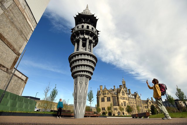 Sculptor Saad Qureshi's 50ft tall sculpture Tower of Now, which was unveiled on Saturday 26 April 2025 on the perimeter of the newly-opened 2.5 acre Norfolk Gardens park in Bradford city centre, UK. The carved wooden structure, commissioned for Bradford's 2025 City of Culture year, brings together architectural elements from Bradford's diverse religious buildings in what the artist describes as a homage to the communities that make up the city and nurtured his creativity. Qureshi grew up in Bradford after moving with his parents from Pakistan at the age of eight. (Photo by Guzelian)