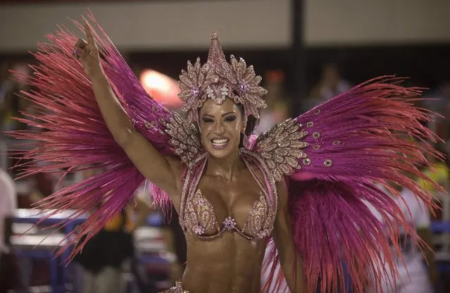 Drum queen Gracyanne Barbosa from the Jacarezinho samba school dances during the first night of the A Group annual Carnival parade in Rio de Janeiro's Sambadrome February 8, 2013.  The Samba School which wins the A Group will parade with the top samba groups at the Special Group performance in 2014. (Photo by Ricardo Moraes/Reuters)