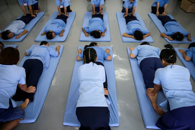 Women prisoners attend a Thai massage class at Chiang Mai Women's Correctional Institute, in Chiang Mai, Thailand, January 24, 2018. (Photo by Athit Perawongmetha/Reuters)