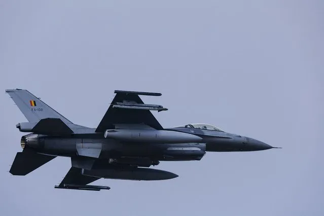 A Belgian F-16 jet fighter takes part in the NATO Air Nuclear drill “Steadfast Noon” (its regular nuclear deterrence exercise) at the Kleine-Brogel air base in Belgium on October 18, 2022. NATO on October 17, 2022 launched its regular nuclear deterrence drills in western Europe, after tensions soared with Russia over President Vladimir Putin's veiled threats in the face of setbacks in Ukraine. The 30-nation alliance has stressed that the “routine, recurring training activity” – which runs until October 30 – was planned before Moscow invaded Ukraine and is not linked to the current situation. (Photo by Kenzo Tribouillard/AFP Photo)