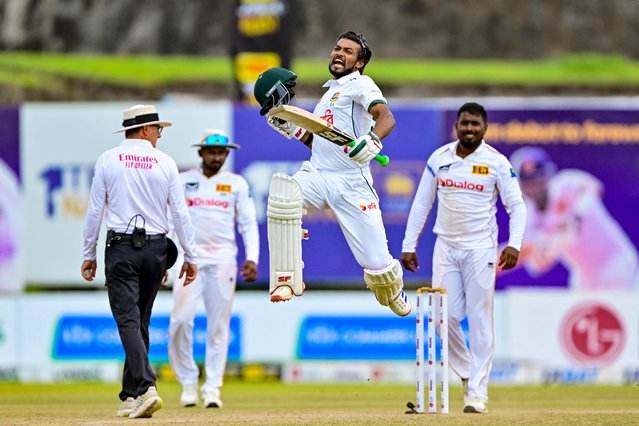 Bangladesh's captain Najmul Hossain Shanto (2R) jumps as he celebrates after scoring a century (100 runs) during the fifth and final day of the first Test cricket match between Sri Lanka and Bangladesh at the Galle International Cricket Stadium in Galle on June 21, 2025. (Photo by Ishara S. Kodikara/AFP Photo)