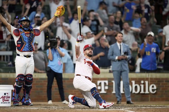 Philadelphia Phillies Kyle Schwarber celebrates after winning the tiebreaker at the MLB baseball All-Star game between the American League and National League, Tuesday, July 15, 2025, in Atlanta. (Photo by Brynn Anderson/AP Photo)