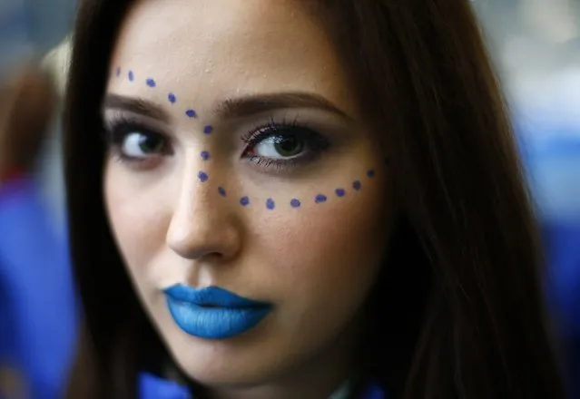 Miss Russia Anastasia Kostenko wears face paint during the Miss World sports competition at the Lee Valley sports complex in north London, November 26, 2014. (Photo by Andrew Winning/Reuters)