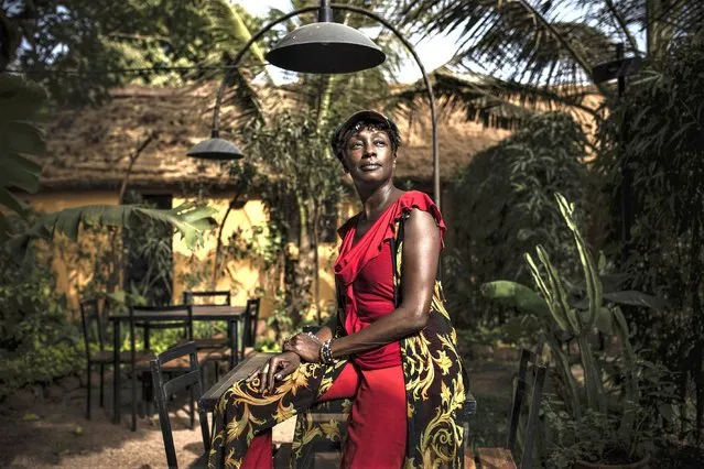 Burkinabe actress Maimouna Ndiaye poses for a photo after an interview in Ouagadougou, Burkina Faso, Tuesday, February 21, 2023. “We only have FESPACO left to prevent us from thinking about what's going on”, said Ndiaye, who has four submissions in this year's competition. “This is the event that must not be cancelled no matter the situation”. (Photo by Sophie Garcia/AP Photo)