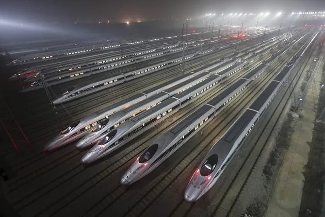 CRH380 (China Railway High-speed) Harmony bullet trains are seen at a high-speed train maintenance base in Wuhan, Hubei province, in this file photo taken December 25, 2012. A team of Chinese firms, along with the Export-Import Bank of China, are interested in designing, building, financing and maintaining California's proposed 800-mile high-speed rail project. (Photo by Reuters/Stringer)