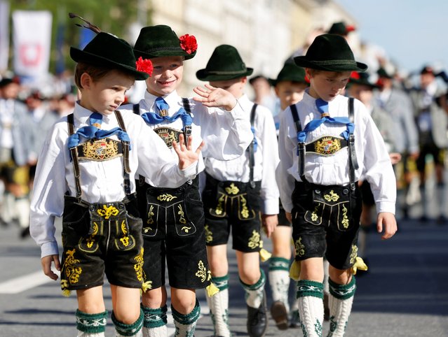 Boys wearing traditional Bavarian Lederhosen march during the traditional costume parade during the 190th Oktoberfest beer festival in Munich, southern Germany on September 21, 2025. The world's biggest beer festival Oktoberfest runs until October 5, 2025. (Photo by Michaela Stache/AFP Photo)