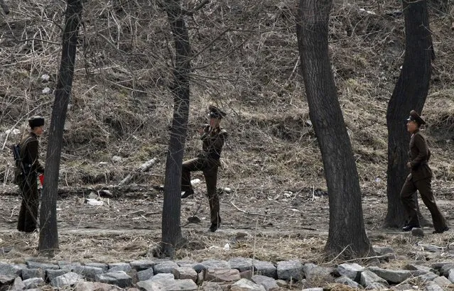 Soldiers at the Yalu river, which serves as a border along hundreds of miles between China and both Koreas. (Photo by Jacky Chen/Reuters)