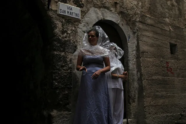 Women wear costumes as part of an art installation in the mostly abandoned old centre of the town of Catsel Vecchio in the province of L'Aquila in Abruzzo, inside the national park of the Gran Sasso e Monti della Laga, Italy, September 11, 2016. (Photo by Siegfried Modola/Reuters)