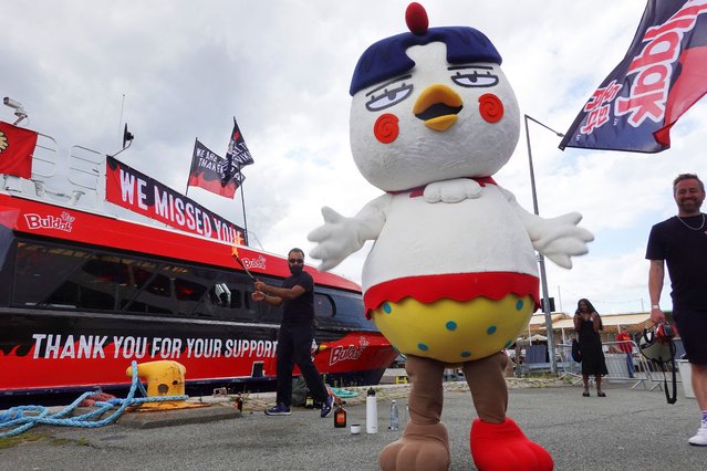 “Hochi” the mascot of Buldak's hot chicken ramen, stands by a boat decorated with the product's logo at a media event in central Copenhagen, Denmark, on August 8, 2024. (Photo by Tom Little/Reuters)