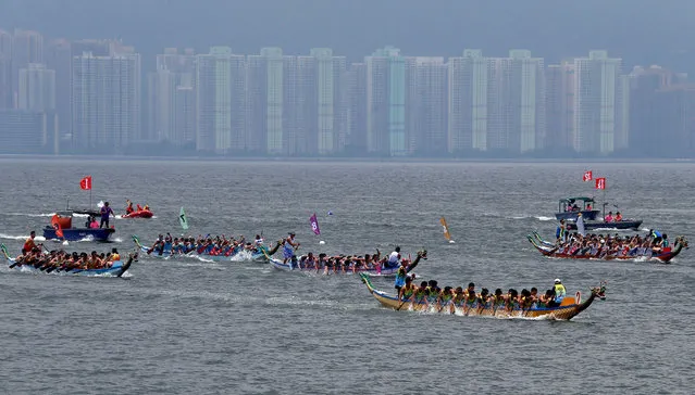 Participants compete during a race to mark Tung Ng or Dragon Boat Festival at Tolo Harbour in Hong Kong June 18, 2018. (Photo by Bobby Yip/Reuters)