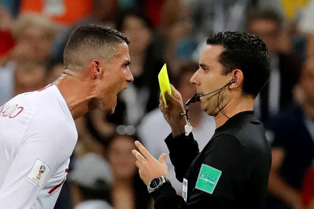 Portugal' s Cristiano Ronaldo (R) talks to referee Cesar Ramos Palazuelos in their 2018 FIFA World Cup Round of 16 football match against Uruguay at Fisht Stadium. Team Uruguay won the game 2:1. (Photo by Toru Hanai/Reuters)