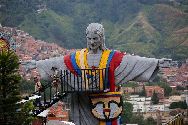 People visit Cristo Redentor Paisa, the largest monument in Latin America created with 3D printing, located in Comuna 13 in Medellin, Colombia on January 2, 2025. (Photo by Juan David Duque/Reuters)