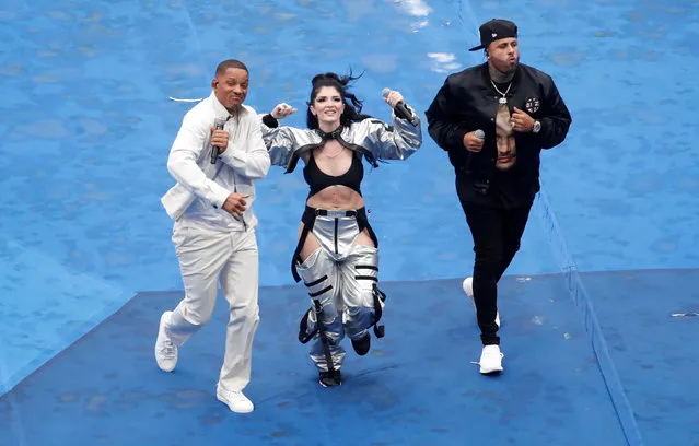 US singer Will Smith (L), Kosovo' s singer Era Istrefi (C) and US rapper Nick Rivera Caminero aka Nicky Jam (R) perform during the closing ceremony prior to the Russia 2018 World Cup final football match between France and Croatia at the Luzhniki Stadium in Moscow on July 15, 2018. (Photo by Christian Hartmann/Reuters)