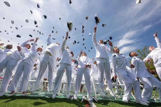U.S. Coast Guard Academy graduates toss their hats into the air to celebrate the conclusion of the 141st Commencement Ceremony at the Coast Guard Academy, May 18, 2022 in New London, Connecticut. The Coast Guard Academy graduated 252 new officers along with nine international students. (Photo by David Lau/U.S. Coast Guard Photo/Alamy Live News)