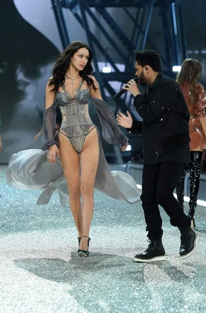 Bella Hadid walks the runway as The Weeknd performs during the 2016 Victoria's Secret Fashion Show on November 30, 2016 in Paris, France. (Photo by Dimitrios Kambouris/Getty Images for Victoria's Secret)
