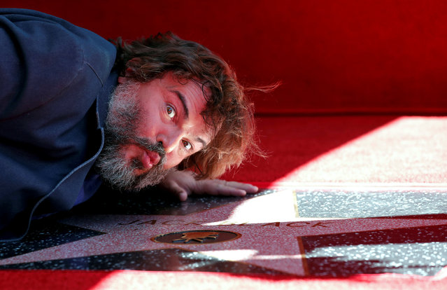 Actor Jack Black kisses his star at its unveiling on the Hollywood Walk of Fame in Los Angeles, California, U.S., September 18, 2018. (Photo by Mario Anzuoni/Reuters)