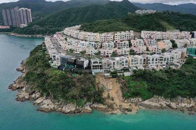This aerial photo shows a landslide at Redhill Peninsula, a luxurious residential estate in the Tai Tam area in Hong Kong on September 12, 2023, after record heavy rains in the territory. Hong Kong was flooded by the heaviest rainfall in nearly 140 years on September 8, 2023, leaving the city's streets and some subway stations under water and forcing its schools to close. (Photo by Peter Parks/AFP Photo)