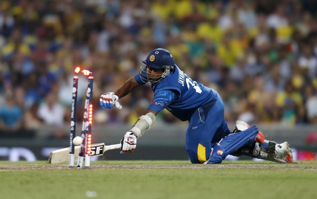 Sri Lanka's Mahela Jayawardene is run out during their Cricket World Cup match against Australia in Sydney, March 8, 2015.    REUTERS/Jason Reed (AUSTRALIA - Tags: SPORT CRICKET)