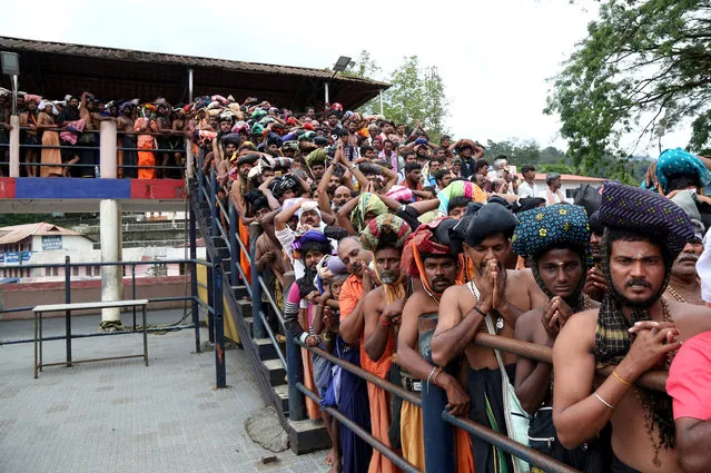 Hindu devotees wait in queues inside the premises of the Sabarimala temple in Pathanamthitta district in the southern state of Kerala, October 17, 2018. (Photo by Sivaram V/Reuters)