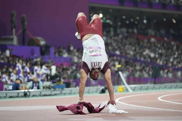 Qatar's Ashraf Elseify celebrates after winning silver medal in the men's hammer throw final at the 19th Asian Games in Hangzhou, China, Saturday, September 30, 2023. (Photo by Vincent Thian/AP Photo)