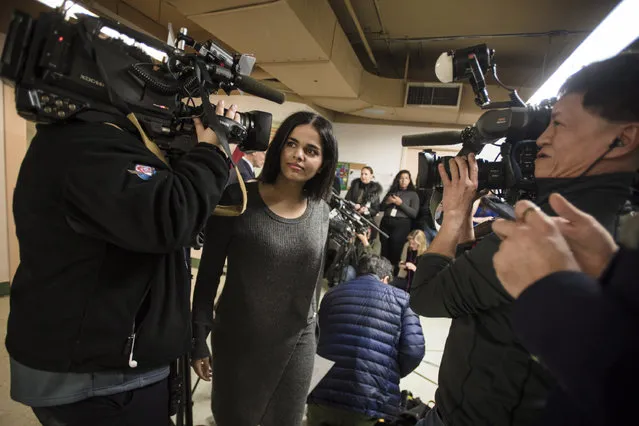 Rahaf Mohammed makes her way through a crowd of media after giving a public statement in Toronto, Tuesday, January 15, 2019. The Saudi teen whose flight from her family captured global attention says she intends to fight for the freedom of women around the world. The 18-year-old ran from her family, whom she alleged was abusive and trying to force her into an arranged marriage. (Photo by Tijana Martin/The Canadian Press via AP Photo)