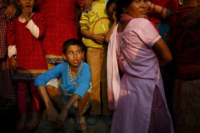 Nepalese people gather to observe the Bisket festival at Bhaktapur April 10, 2015. (Photo by Navesh Chitrakar/Reuters)