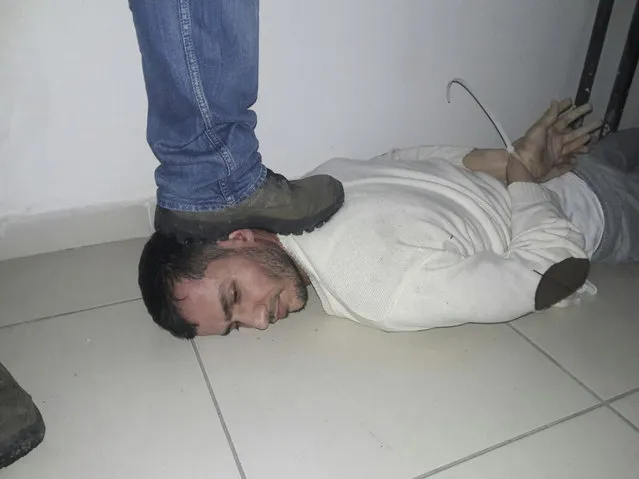 An unidentified man is subdued, detained during a police operation to capture Reina club attacker, in Istanbul, Turkey, late Monday, January 16, 2017. Turkish media reports say police have caught the gunman who killed 39 people during New Year's celebrations on an Istanbul nightclub, detained during a police operation. (Photo by Depo Photos via AP Photo)