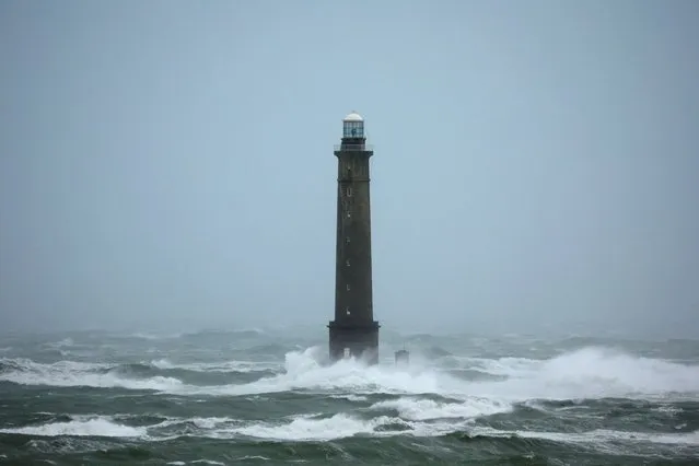 Waves crash on Goury lighthouse during Storm Ciaran at Goury near Cherbourg, Normandy, France on November 2, 2023. (Photo by Pascal Rossignol/Reuters)