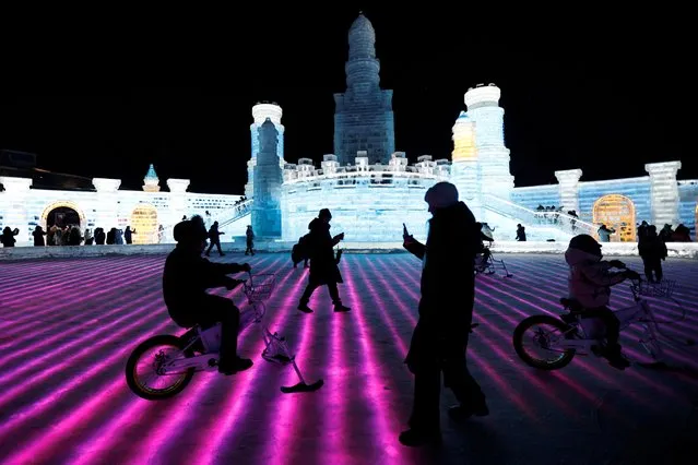 People enjoy themselves at the Harbin International Ice and Snow Festival, in Harbin, Heilongjiang province, China on January 4, 2024. (Photo by Tingshu Wang/Reuters)