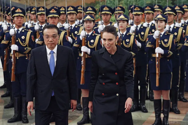 New Zealand Prime Minister Jacinda Ardern, right, walks with Chinese Premier Li Keqiang during a welcome ceremony at the Great Hall of the People in Beijing, Money, April 1, 2019. (Photo by Andy Wong/AP Photo)