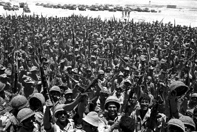 This June 10, 1967 file photo shows jubilant Israeli troops in Sinai, Egypt, during the Six-Day War. In the 1967 Mideast war, when Israel seized the West Bank and Gaza Strip, 300,000 more Palestinians fled, mostly into Jordan. The refugees and their descendants now number nearly 6 million, most living in camps and communities in the West Bank, Gaza, Lebanon, Syria and Jordan. The diaspora has spread further, with many refugees building lives in Gulf Arab countries or the West. (Photo by AP Photo, File)