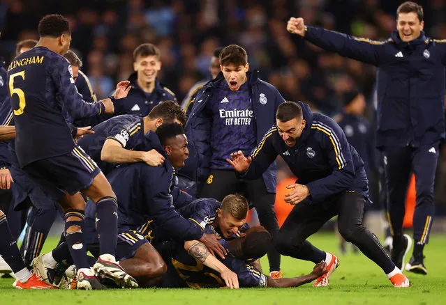 Players of Ral Madrid celebrate after winning the UEFA Champions League quarter-final second leg match between Manchester City and Real Madrid CF at Etihad Stadium on April 17, 2024 in Manchester, United Kingdom. (Photo by Carl Recine/Reuters)