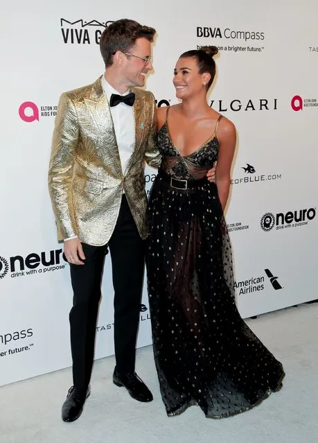 US fashion stylist and television personality Brad Goreski and actress Lea Michele pose upon their arrival for the 25th annual Elton John AIDS Foundation's Academy Awards Viewing Party on February 26, 2017 in West Hollywood, California. (Photo by Tibrina Hobson/AFP Photo)