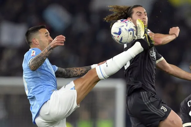 Juventus' Adrien Rabiot, right, jumps for the ball with Lazio's Matias Vecino during the Italian Cup semi-final soccer match between Lazio and Juventus at Rome's Olympic Stadium, Italy, Tuesday, April 23, 2024. (Photo by Alfredo Falcone/LaPresse via AP Photo)