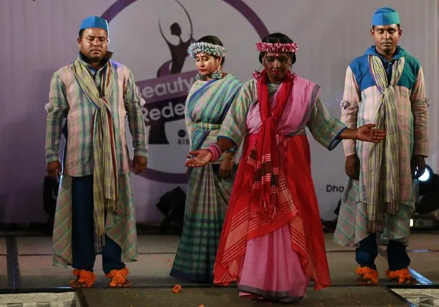 In this March 7, 2017 photo, Bangladeshi acid attack survivor walk down the catwalk during the event “Beauty Redefined” in Dhaka, Bangladesh. The models, including three men, walked the catwalk, dancing and singing and showcasing woven handloom Bangladeshi designs and the show was choreographed by local designer Bibi Russel. (Photo by A.M. Ahad/AP Photo)