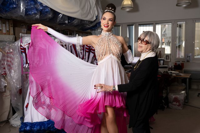 Artistic advisor Mine Verges (R), in charge of the creation of the dancers' costumes, poses with Australian dancer Madison (L) in her atelier at the Moulin Rouge musical cabaret in Paris on March 21, 2024. (Photo by Miguel Medina/AFP Photo)