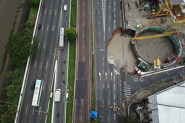 Aerial view showing an accident during the construction of Line 6-Orange of the Sao Paulo's Metro that shut down Marginal Tiete Avenue in Sao Paulo, Brazil, on February 1, 2022. (Photo by Filipe Araujo/AFP Photo)